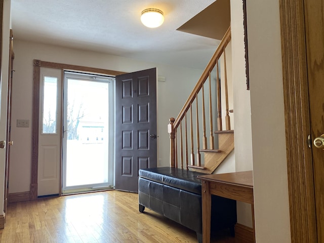 entryway with light hardwood / wood-style flooring