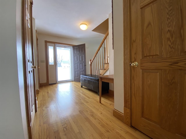 foyer entrance with light wood-type flooring