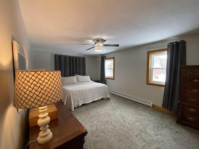 carpeted bedroom with a baseboard radiator and ceiling fan