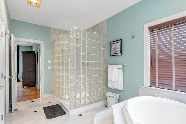 bathroom featuring plus walk in shower