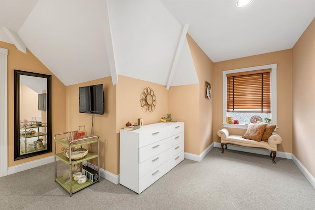 living area featuring carpet flooring and vaulted ceiling with beams