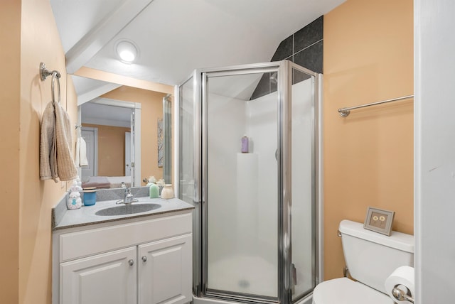 bathroom with toilet, an enclosed shower, and vanity