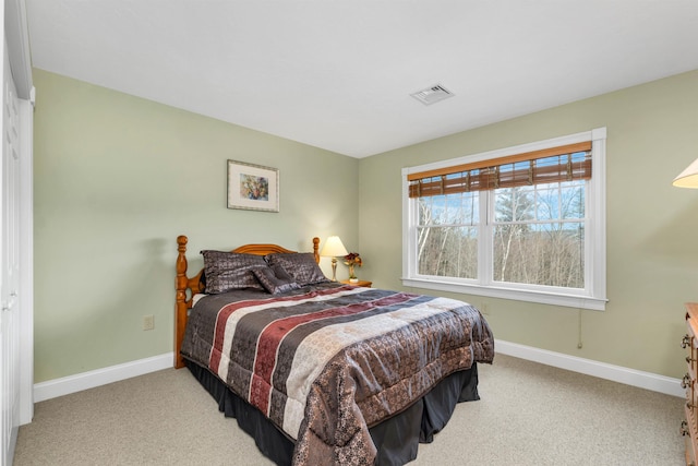 bedroom with light colored carpet