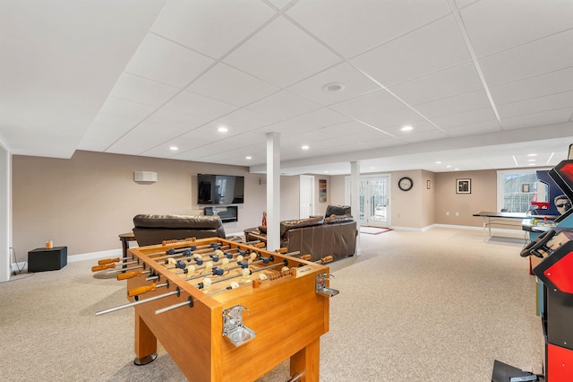 rec room featuring carpet and a paneled ceiling