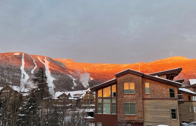 view of snowy exterior with a mountain view