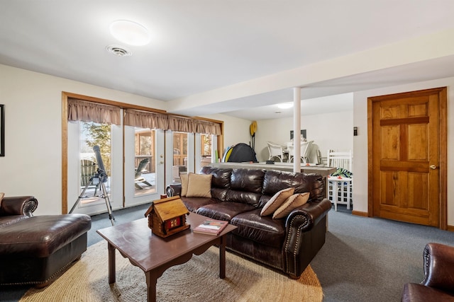 living room featuring carpet and visible vents