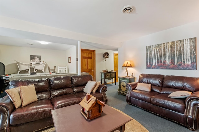 living area with carpet floors and visible vents