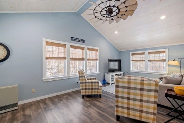 living area with dark wood-type flooring, lofted ceiling, and a healthy amount of sunlight