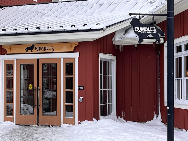 view of snow covered property entrance