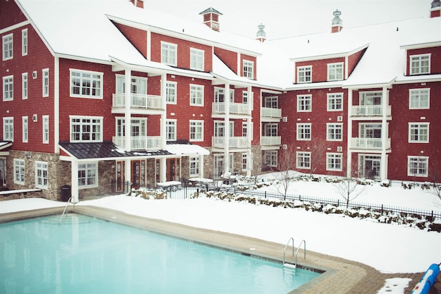 view of snow covered pool