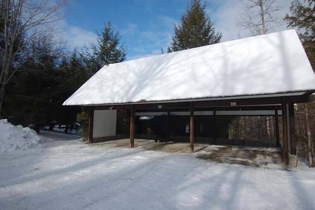 exterior space with a carport