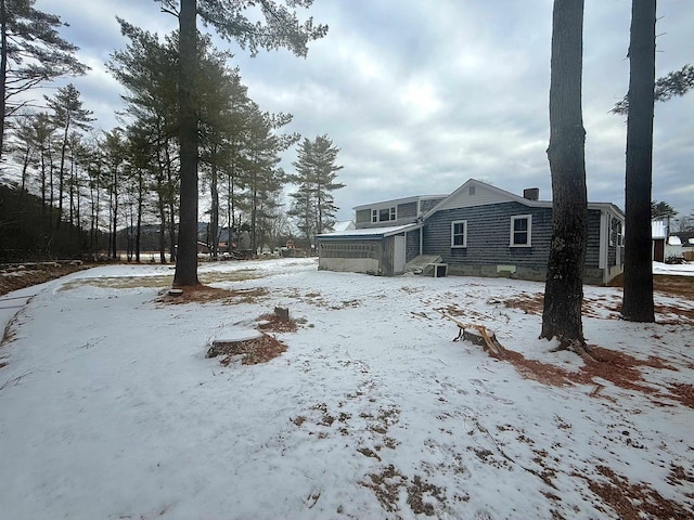 view of yard layered in snow