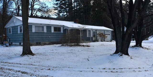 single story home featuring a garage