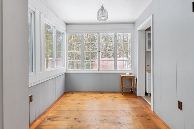 unfurnished sunroom with a healthy amount of sunlight