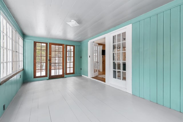 unfurnished sunroom featuring french doors