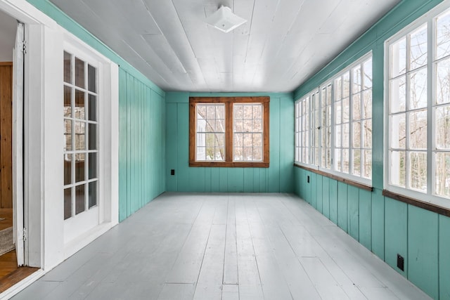 unfurnished sunroom with wooden ceiling