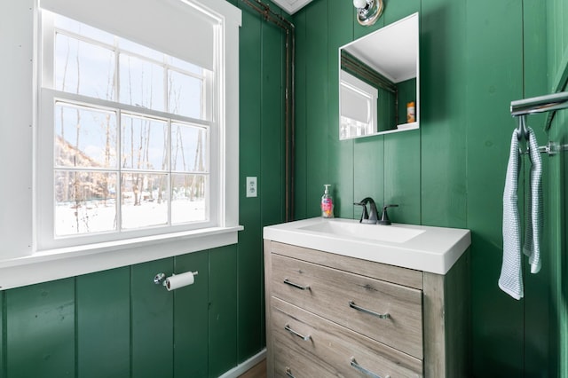 bathroom with vanity and crown molding