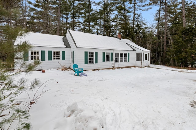 view of snow covered house