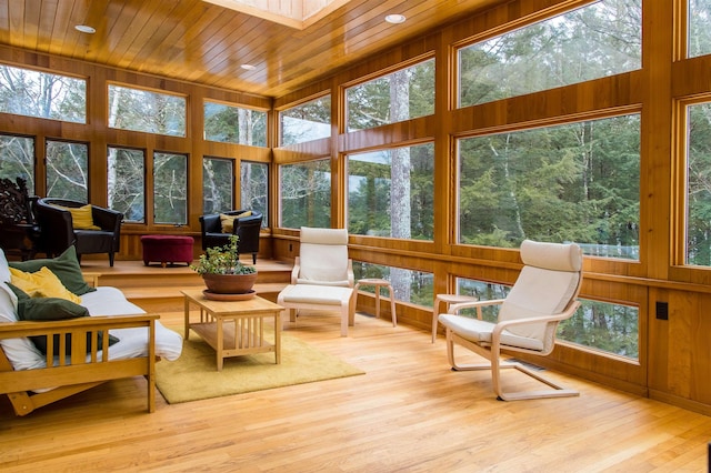 sunroom / solarium featuring wooden ceiling and a wealth of natural light