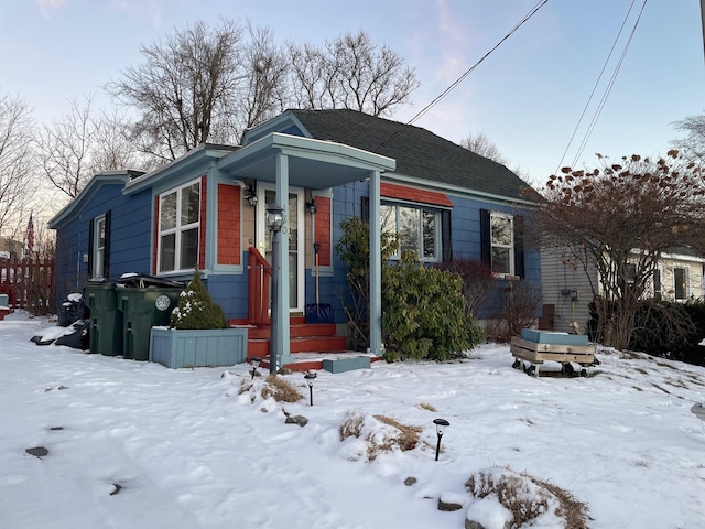 view of front facade featuring roof with shingles