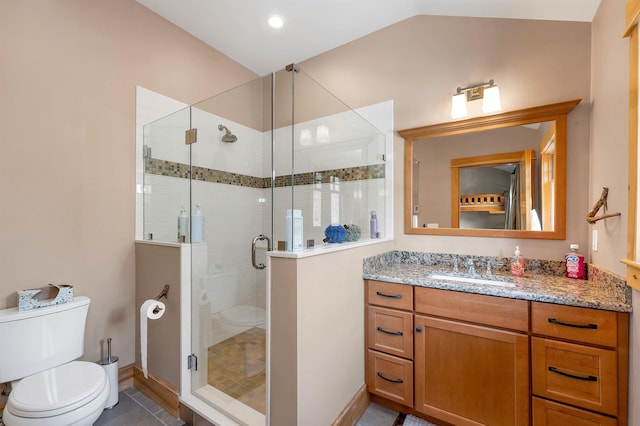 bathroom with toilet, tile patterned floors, a shower with door, and vanity