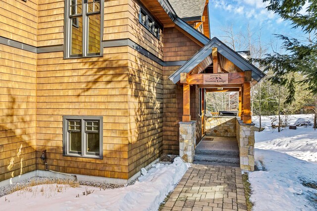 view of snow covered property entrance