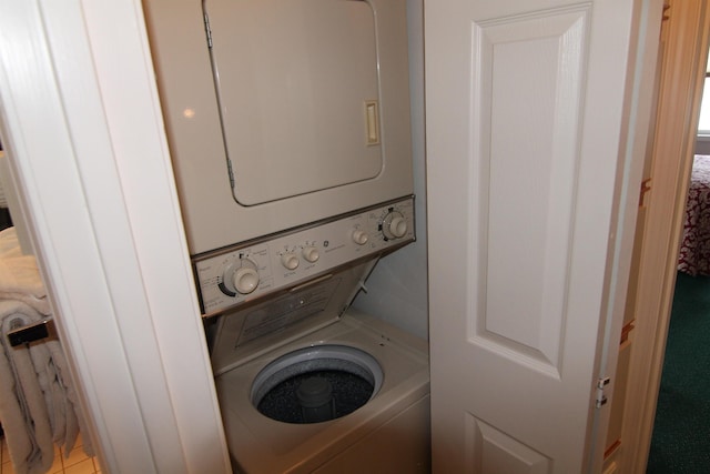 washroom with stacked washer / dryer