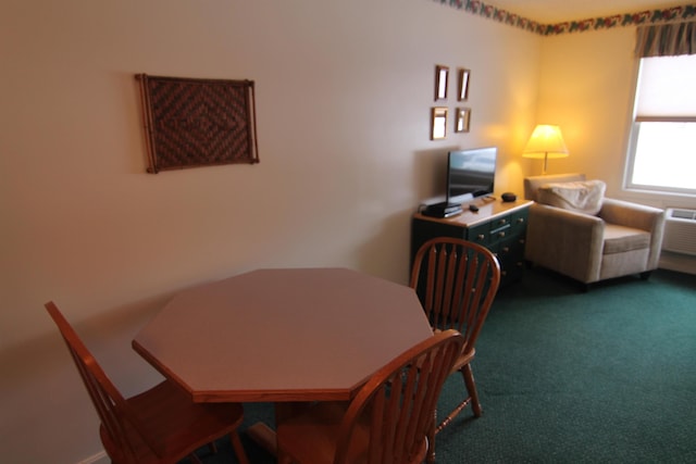 carpeted dining area with a wall mounted air conditioner