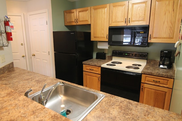 kitchen featuring black appliances and sink