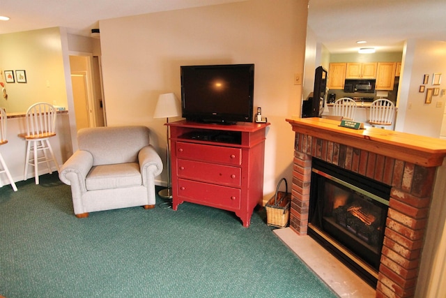 carpeted living room with a brick fireplace