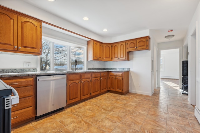 kitchen featuring range, dishwasher, a baseboard radiator, and sink