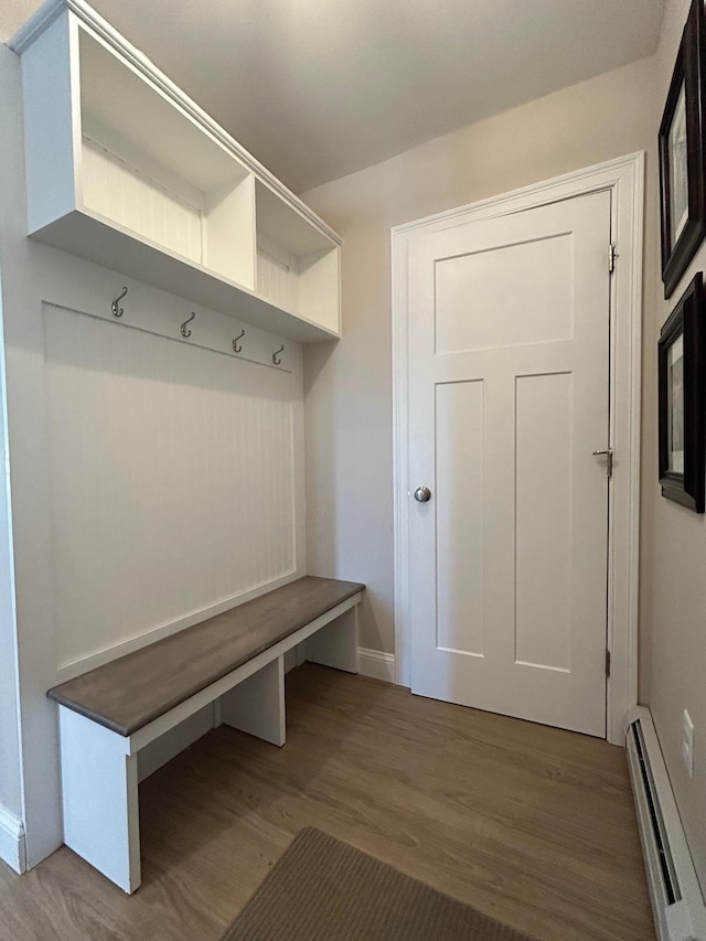 mudroom with baseboard heating and hardwood / wood-style floors