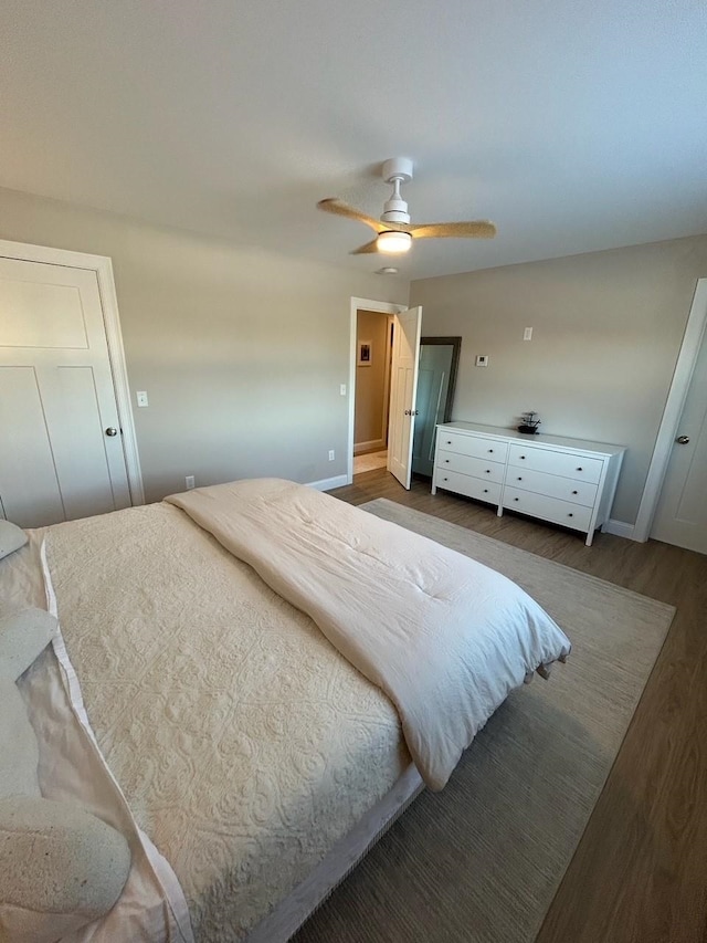 bedroom featuring ceiling fan and dark hardwood / wood-style floors