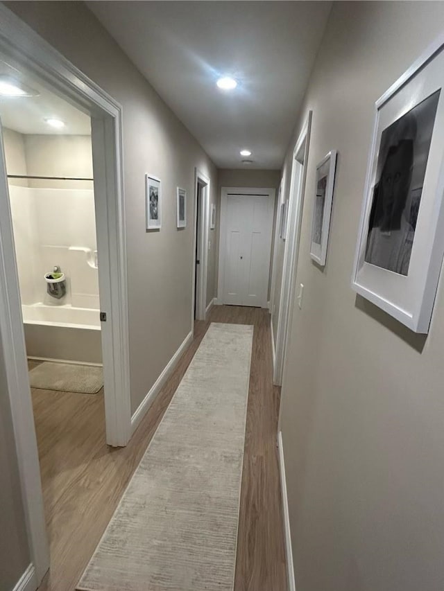 corridor featuring hardwood / wood-style flooring