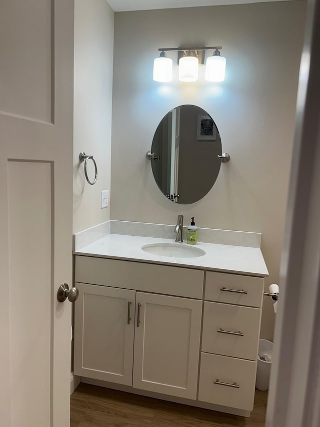 bathroom featuring vanity and wood-type flooring