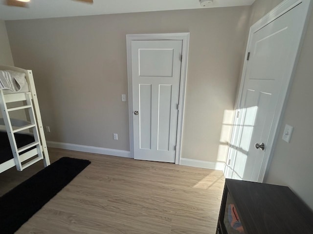 bedroom with light hardwood / wood-style flooring