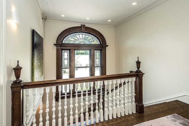 interior space with ornamental molding and dark hardwood / wood-style flooring