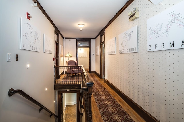 corridor with dark hardwood / wood-style flooring and crown molding