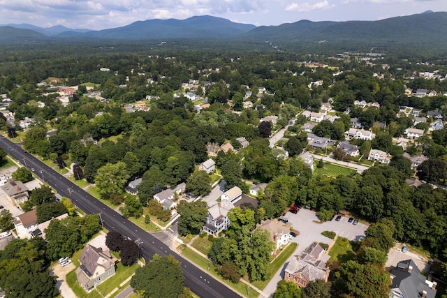 birds eye view of property featuring a mountain view