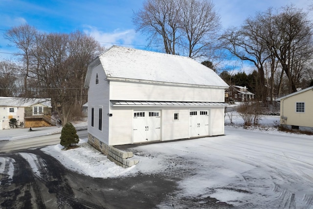 view of snow covered garage