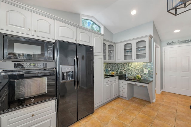 kitchen with light tile patterned floors, white cabinetry, backsplash, vaulted ceiling, and black appliances