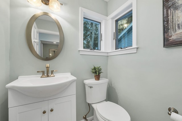 bathroom featuring toilet and vanity