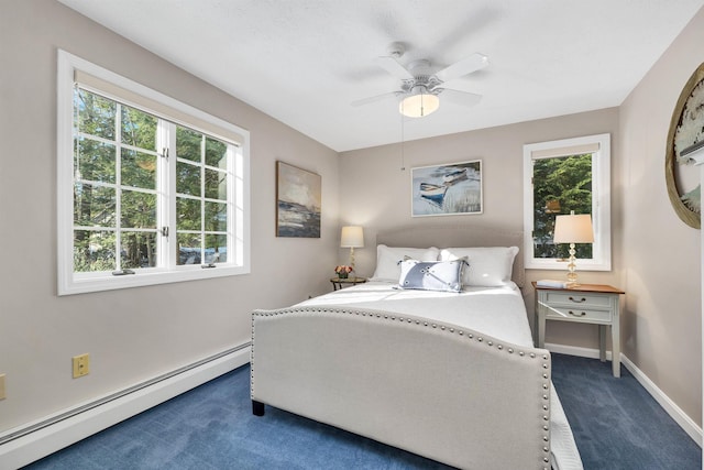 bedroom with ceiling fan, baseboard heating, and dark colored carpet