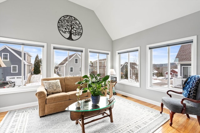 sunroom / solarium with vaulted ceiling