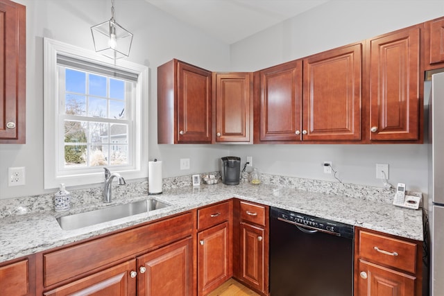 kitchen featuring light stone countertops, dishwasher, and sink