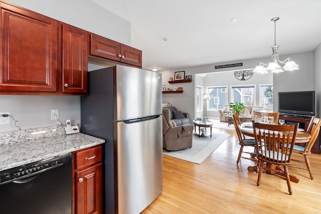 kitchen featuring dishwasher, stainless steel refrigerator, light hardwood / wood-style flooring, light stone counters, and a chandelier