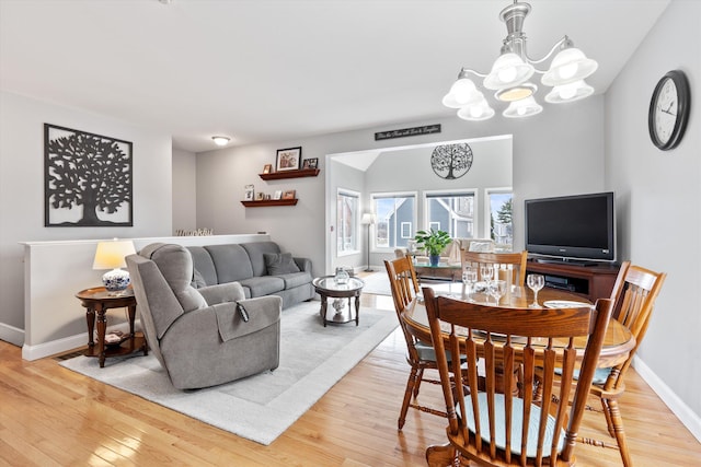 living room featuring hardwood / wood-style flooring and a chandelier