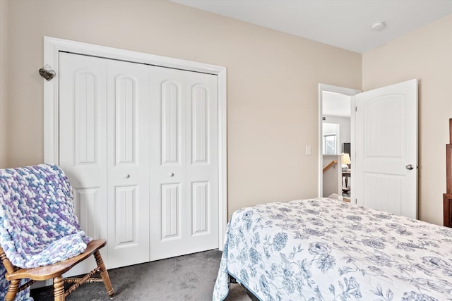 carpeted bedroom with a closet