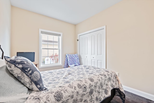 carpeted bedroom featuring a closet