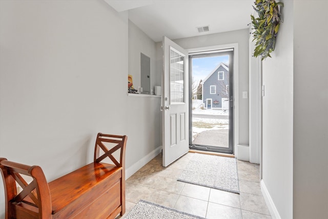 tiled entryway featuring electric panel